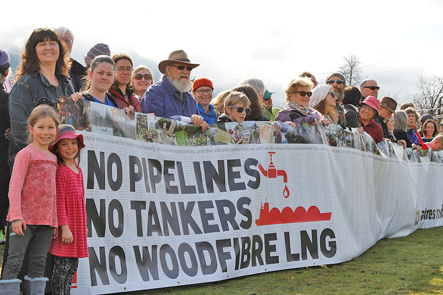 Protesters attend an open house about Woodfibre LNG
